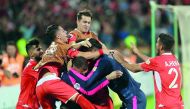 Perspolis’ players celebrate after scoring during the AFC Champions League quarter-final match against Al Duhail SC at the Azadi Stadium in the Iranian capital Tehran, yesterday.