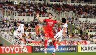 Kashima Antlers' Serginho (L) and Kento Misao (R) compete for the ball with Tianjin Quanjian's Alexandre Pato during the Asian Champions League quarter-final football match between China's Tianjin Quanjian and Japan's Kashima Antlers in Macau on September