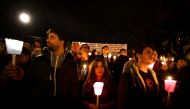 People hold candles in honor of Stefano Cucchi, a young Italian man who died in custody at Rome's Pertini prison hospital in 2010, during a demonstration in front of the italian Supreme Council of Judiciary on November 8, 2014 in Rome. The protest was org