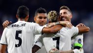 Real Madrid's Spanish-Dominican forward Mariano (2R) celebrates his goal with Real Madrid's Spanish defender Sergio Ramos (R) during the UEFA Champions League group G football match between Real Madrid CF and AS Roma at the Santiago Bernabeu stadium in Ma