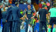 Juventus' Portuguese forward Cristiano Ronaldo (C) cries after receiving a red card during the UEFA Champions League group H football match between Valencia CF and Juventus FC at the Mestalla stadium in Valencia on September 19, 2018.  AFP / Jose Jordan
