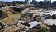A picture taken on September 23, 2018, in the Tunisian coastal town of Nabeul shows the collapsed Bir Challouf bridge following deadly flash flooding. / AFP / FETHI BELAID 