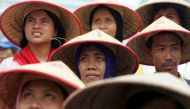 Indonesian farmers attend a large protest over land reform and other agricultural issues in central Jakarta June 8, 2004. Reuters/Darren Whiteside