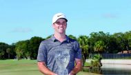 Denny McCarthy poses with the Finals Money Winner Trophy after the fourth and final round of the Web.com Tour Championship held at Atlantic Beach Country Club on September 23, 2018 in Atlantic Beach, Florida. Michael Cohen/Getty Images/AFP