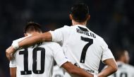 Juventus' Argentinian forward Paulo Dybala (L) celebrates with Juventus' Portuguese forward Cristiano Ronaldo (R) after scoring a goal during the Italian Serie A football match between Juventus and Bologna on September 26, 2018 at the Allianz Stadium in T