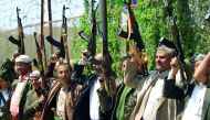 Tribal gunmen loyal to the Huthi movement brandish their weapons during a gathering in Sanaa to show support to the Shiite Huthi militia against the Saudi-led intervention i in the capital Sanaa on September 27, 2018. AFP / Mohammed Huwais