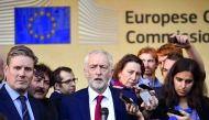 Labour Party leader Jeremy Corbyn (C), next to Labour's Brexit pointman Keir Starmer (L), gives a press conference after the meeting with senior EU officials in Brussels after warning he may oppose any Brexit deal negotiated by the London government, at B