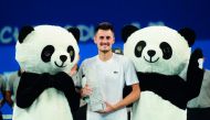 Bernard Tomic of Australia celebrates after winning the men's singles final against Fabio Fognini of Italy at the ATP Chengdu Open tennis tournament in Chengdu, in China's southwest Sichuan province on September 30, 2018. China OUT
/ AFP 