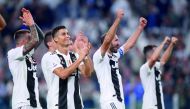 Juventus' Cristiano Ronaldo applauds fans after the match with team mates. Reuters/Alberto Lingria 
