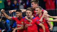 CSKA Moscow’s Croatian midfielder Nikola Vlasic (centre) celebrates with team-mates after scoring goal against Real Madrid CF in Moscow, yesterday. 
