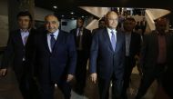 Newly designated Iraqi Prime Minister Adel Abdul Mahdi (2nd L) walks out of the Parliament with newly-elected Iraqi President Barham Saleh (R). / AFP / AHMAD AL-RUBAYE