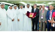 Nabil Zniber (fourth right), the Moroccan Ambassador to Qatar, receiving a memento from Mohamed bin Ahmed bin Towar Al Kuwari (centre), Vice-Chairman, Qatar Chamber, as other QC officials and visiting ASMEX delegation look on, yesterday at QC premises.