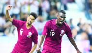 Qatari forward Almoez Ali (right) celebrates with team-mate Akram Afif after scoring his second goal during their international friendly match against Ecuador at the Al Sadd Stadium in Doha yesterday.