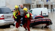 Rescue workers evacuate residents from a neighbourhood after flash floods hit the southwestern Aude district of France after several months' worth of rain fell in just a few hours overnight, in Trebes, France, October 15, 2018. Reuters/Jean-Paul Pelissier