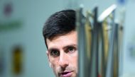 Novak Djokovic of Serbia attends a press conference after beating Borna Coric of Croatia in their men's singles final match at the Shanghai Masters tennis tournament on October 14, 2018.  AFP / Johannes Eisele
