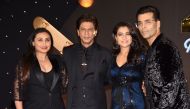 Indian Bollywood actors Rani Mukharjee (L), Shah Rukh Khan (2L) and Kajol Devgan (2R) and Director Karan Johar pose for a picture as they attend an event celebrating the 20th anniversary of the Hindi film 