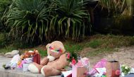 Gifts presented by well-wishers to Britain's Prince Harry and his wife Meghan, Duchess of Sussex for their upcoming baby are seen at Sydney's iconic Bondi Beach on October 19, 2018. AFP / Saeed Khan 