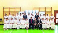 Participants with QIB officials during the financial literacy program.