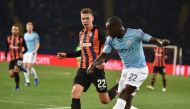 Shakhtar's Ukrainian defender Mykola Matviyenko (L) vies with Manchester City's French defender Benjamin Mendy during the UEFA Champions League football match between Shakhtar Donetsk and Manchester City at the Metallist stadium in Kharkiv, on October 23,