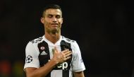 Juventus' Portuguese striker Cristiano Ronaldo gestures to supporters on the pitch after the Champions League group H football match between Manchester United and Juventus at Old Trafford in Manchester, north west England, on October 23, 2018.  / AFP / Ol