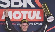 Jonathan Rea celebrates on the podium after winning the first race of WorldSBK yesterday.