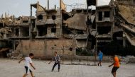 Children play football in al-Khalidiya area, in the government-controlled part of Homs, Syria, September 18, 2018.   REUTERS/Marko Djurica