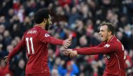 Liverpool's Swiss midfielder Xherdan Shaqiri (R) celebrates scoring their third goal with Liverpool's Egyptian midfielder Mohamed Salah (L) during the English Premier League football match between Liverpool and Cardiff City at Anfield in Liverpool, north 