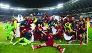 Qatar players and officials celebrate after winning their AFC U-19 Championship quarter-final match against Thailand yesterday. 