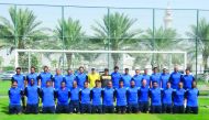Coaches who took part in the Football Workshop pose for a picture.