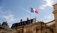 The French national flag flutters in the wind at the entrance of the Hotel Matignon, in Paris, on November 5, 2018.  AFP / Thomas Samson 