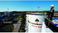 A worker is seen at the central processing facility of the Rosneft owned Priobskoye oil field outside the West Siberian city of Nefteyugansk.
