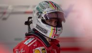 Ferrari's German driver Sebastian Vettel waits at the paddock to get back to his car during the second training session of the F1 Brazil Grand Prix at the Interlagos racetrack in Sao Paulo, Brazil on November 09, 2018. / AFP / Mauro Pimentel
