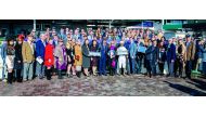 The podium winners and other guests at the Breeders’ Cup pose for a picture during the victory ceremony.