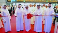 H E Ali bin Ahmed Al Kuwari (centre), Minister of Commerce and Industry; H E Sheikh Abdulla bin Saoud Al Thani (second right), Governor of Qatar Central Bank; Abdulaziz bin Nasser Al Khalifa (second left), CEO of QDB; and other senior officials during the