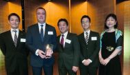 Martin Aherne, General Manager, Automotive at Saleh Al Hamad Al Mana Co, receiving the award presented by Norihide Tomita, General Manager,  Global Aftersales Network Department at Nissan Motors Corporation, in Japan.