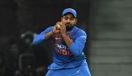 Indian captain Rohit Sharma takes a catch to dismiss West Indies batsman Keemo Paul during the second T20 cricket match between India and West Indies at The Bharat Ratna Atal Bihari Vajpayee Ekana Cricket Stadium in Lucknow on November 6, 2018. GETTYOUT /