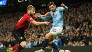 Manchester United's English defender Luke Shaw (L) vies with Manchester City's Portuguese midfielder Bernardo Silva during the English Premier League football match between Manchester City and Manchester United at the Etihad Stadium in Manchester, north w