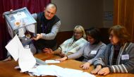 The election commission members count ballots at polling station in Donetsk, in the rebel-held area of eastern Ukraine on November 11, 2018, as Kremlin-backed separatists choose their new leaders despite Western calls on Moscow not to sabotage peace talks