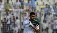 Bangladesh cricket captain Mohammad Mahmudullah reacts after scoring a century during the fourth day of the second Test cricket match between Bangladesh and Zimbabwe at the Sher-e-Bangla National Cricket Stadium in Dhaka on November 14, 2018. / AFP / MUNI