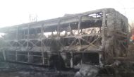 The burnt out remains of a passenger bus that caught fire are seen near Beitbridge, Zimbabwe, in this undated handout picture received November 16, 2018. Zimbabwe Red Cross/ Via Reuters 
