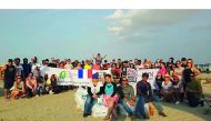 Volunteers after cleaning at Al Zubara beach. 