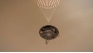 This illustration shows a simulated view of NASA's InSight lander descending on its parachute toward the surface of Mars. Credits: NASA/JPL-Caltech
