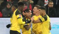 Dortmund's Spanish forward Paco Alcacer (C) is congratulated by teammates after scoring the 1-0 during the German first division Bundesliga football match between FSV Mainz 05 and Borussia Dortmund in Mainz, western Germany on November 24, 2018.  AFP / Da