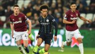 Manchester City's German midfielder Leroy Sane (C) runs with the ball during the English Premier League football match between West Ham United and Manchester City at The London Stadium, in east London on November 24, 2018.  AFP / Glyn KIRK 