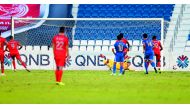 Al Duhail’s Youssef El Arabi (left) scores their winning goal against Al Arabi yesterday.