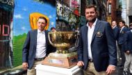 Australia's Cameron Smith (L) and Marc Leishman pose with the Golf World Cup trophy in Melbourne on November 20, 2018. AFP / William WEST