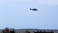 Rescue and recovery missions search for the bodies of dead passengers after a cruise boat capsized in Lake Victoria off Mukono district, Uganda November 25, 2018. REUTERS/James Akena