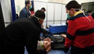 A woman lies on a stretcher inside a hospital after what the Syrian state media said was a suspected toxic gas attack in Aleppo, Syria November 24, 2018. Picture taken November 24, 2018. SANA