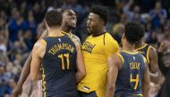 November 24, 2018; Oakland, CA, USA; Golden State Warriors guard Klay Thompson (11) is congratulated by forward Kevon Looney (5), forward Jordan Bell (2), and guard Quinn Cook (4) after making the game-winning basket against the Sacramento Kings during th