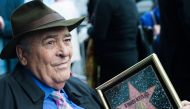 (FILES) In this file photo taken on November 19, 2013 Italian director Bernardo Bertolucci celebrates his Star on the Hollywood Walk of Fame in Hollywood, California. AFP / GETTY IMAGES NORTH AMERICA / Valerie MACON